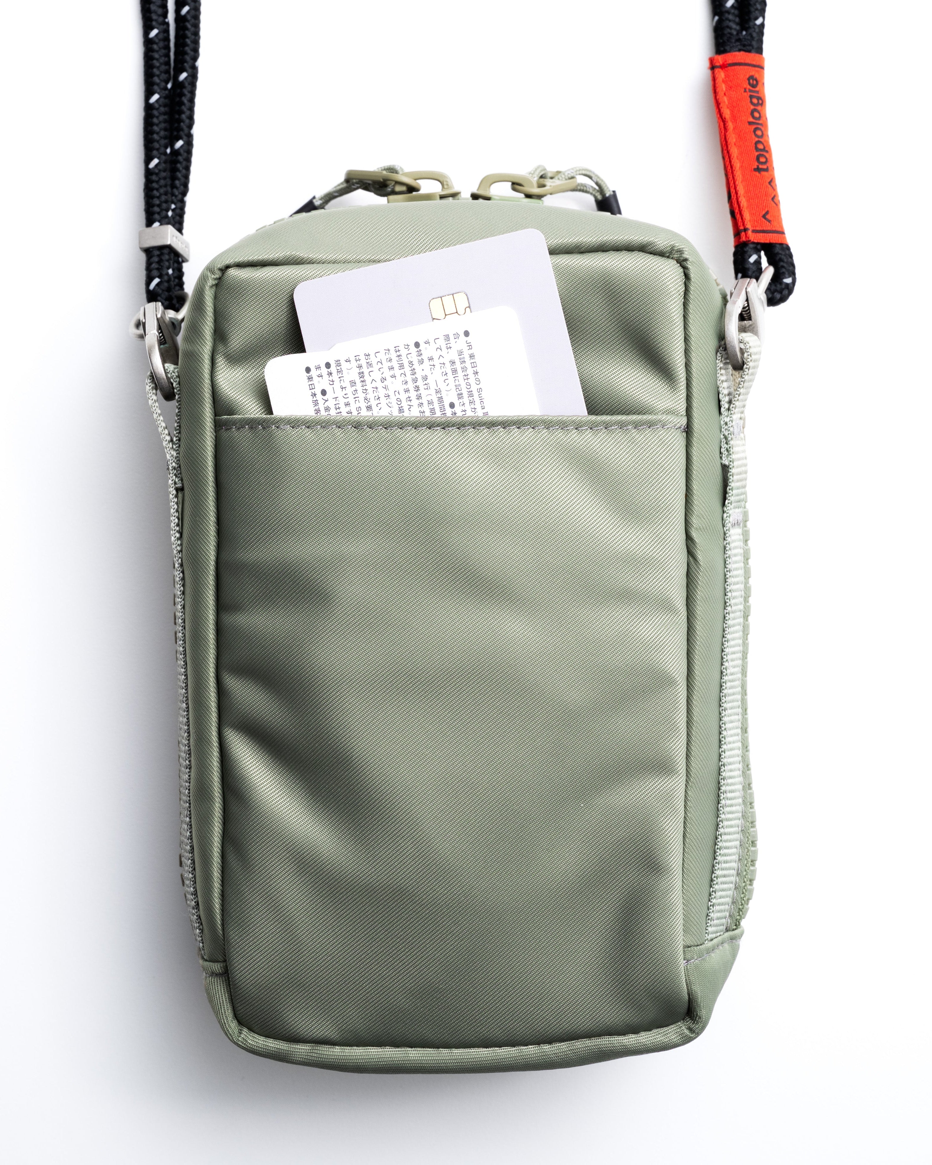 Utility Phone Sacoche (ユーティリティ フォン サコッシュ) / Taupe / Bungee Wrist Strap / Topologie Red