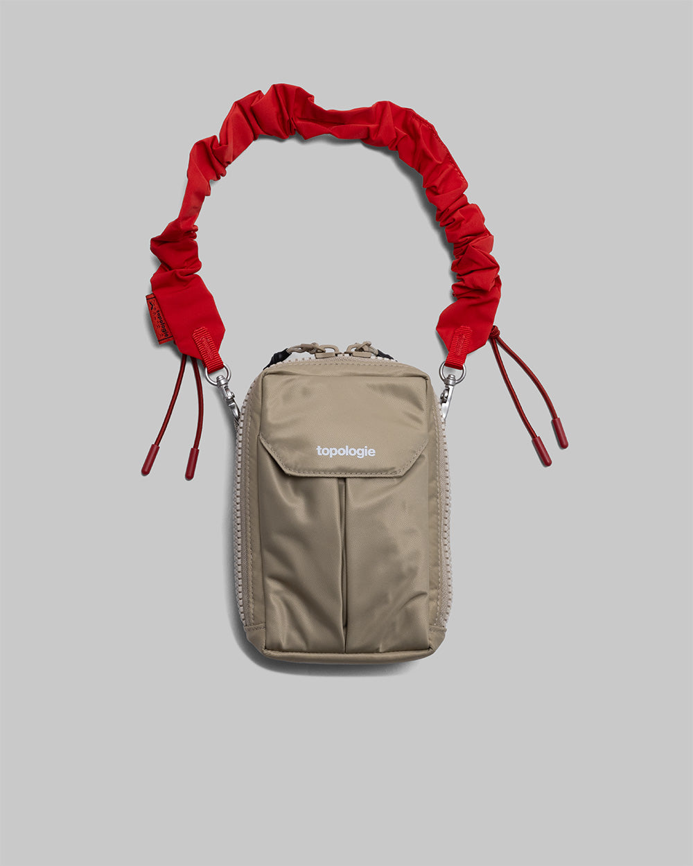 Utility Phone Sacoche (ユーティリティ フォン サコッシュ) / Taupe / Bungee Wrist Strap / Topologie Red